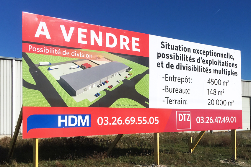 Signalétique panneau de chantier DTZ Cushman&Wakefield communication immobilier réalisation