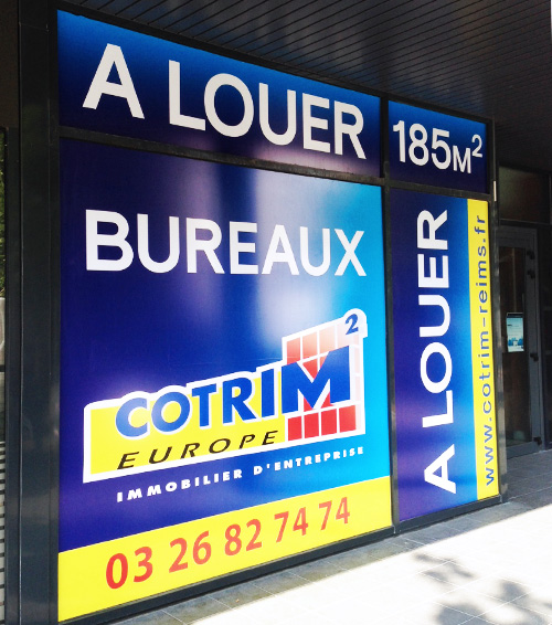 réalisation adhésifs et pose pour marquage vitrine cotrim2 europe immobilier d'entreprise signalétique communication publicité